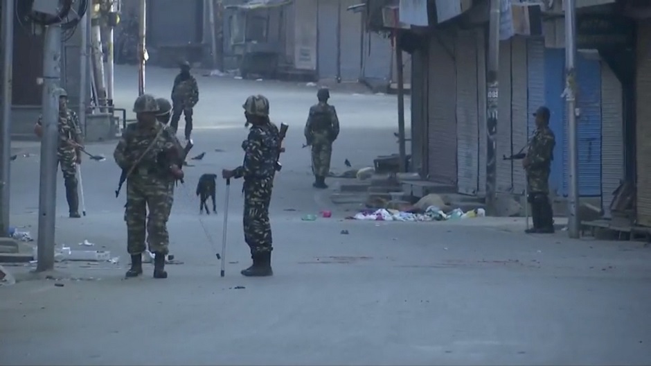 Security personnel patrol a street in Srinagar August 5, 2019 in this still image taken from a video. (Photo: ANI via REUTERS)