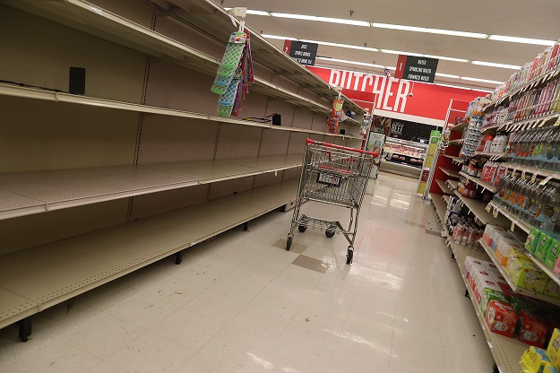 Empty shelves that held water are seen at a store as people stock up before the possible arrival of Hurricane Dorian. PHOTO: AFP