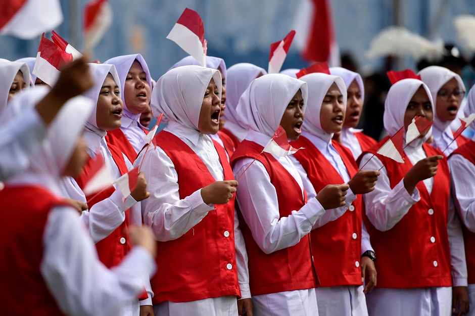Students sing the national anthem to celebrate Indonesia's 74th Independence Day in Blang Pidie, Aceh province. PHOTO: AFP