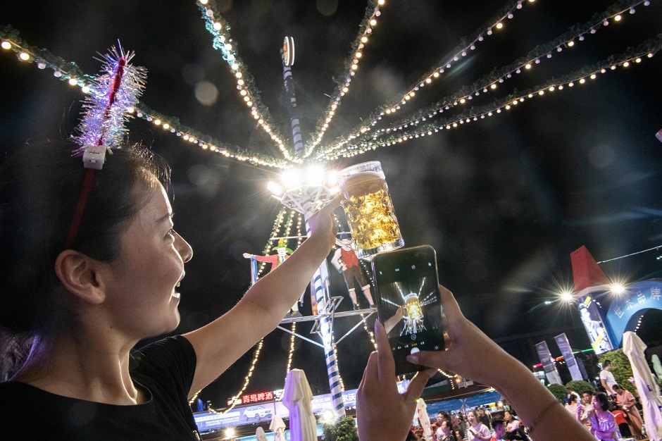 In this photo people take part in the annual Qingdao Beer Festival in China's eastern Shandong province. PHOTO: AFP