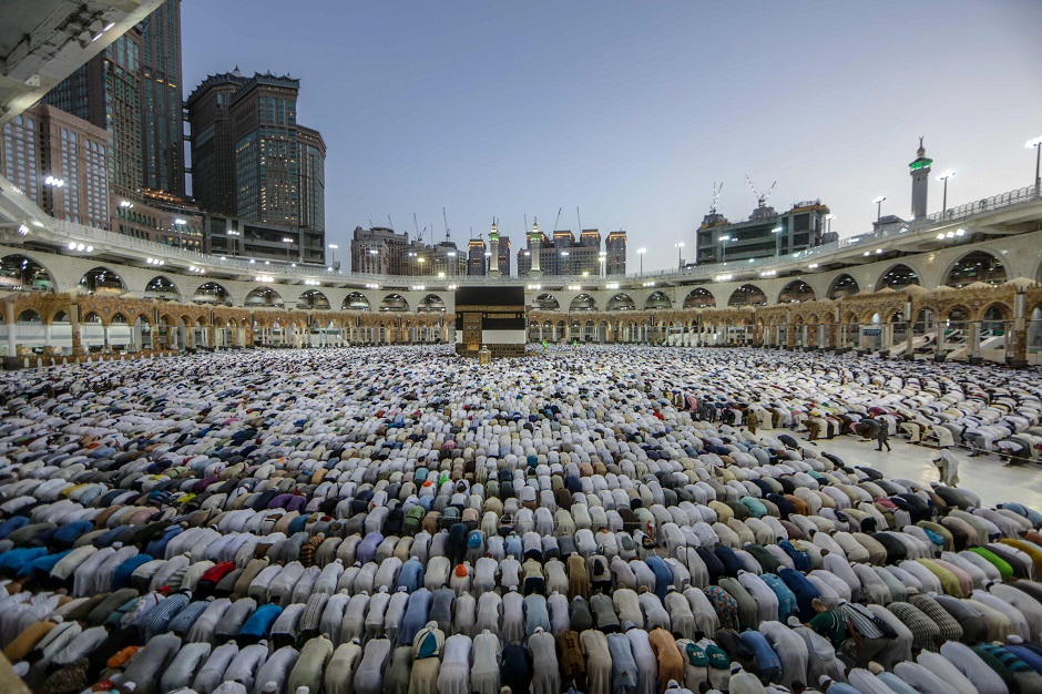 Muslim pilgrims perform prayers around the Kaaba, Islam's holiest shrine, at the Grand Mosque in Saudi Arabia's holy city of Mecca, prior to the start of the annual Hajj pilgrimage in the holy city. PHOTO: AFP
