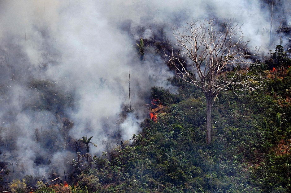 Aerial picture showing a fire in a piece of land in the Amazon rainforest, about 65 km from Porto Velho, in the state of Rondonia, in northern Brazil. PHOTO: AFP