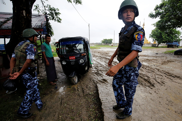 Myanmar police officer stands guard in Maungdaw, Rakhine July 9, 2019. PHOTO: REUTERS