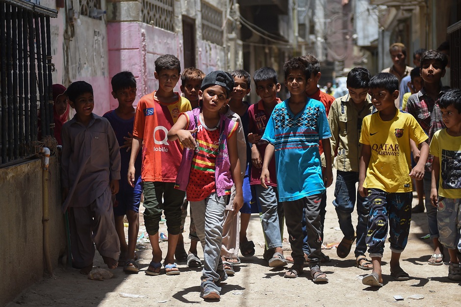 In this picture, eight-year-old rapper Waqas Baloch (C) performs in a part of Karachi, known as Lyari. PHOTO: AFP
