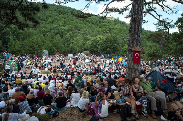 People attend a recital by Turkey's pianist and composer Fazil Say against deforestation near the town of Kirazli in Turkey. PHOTO: AFP