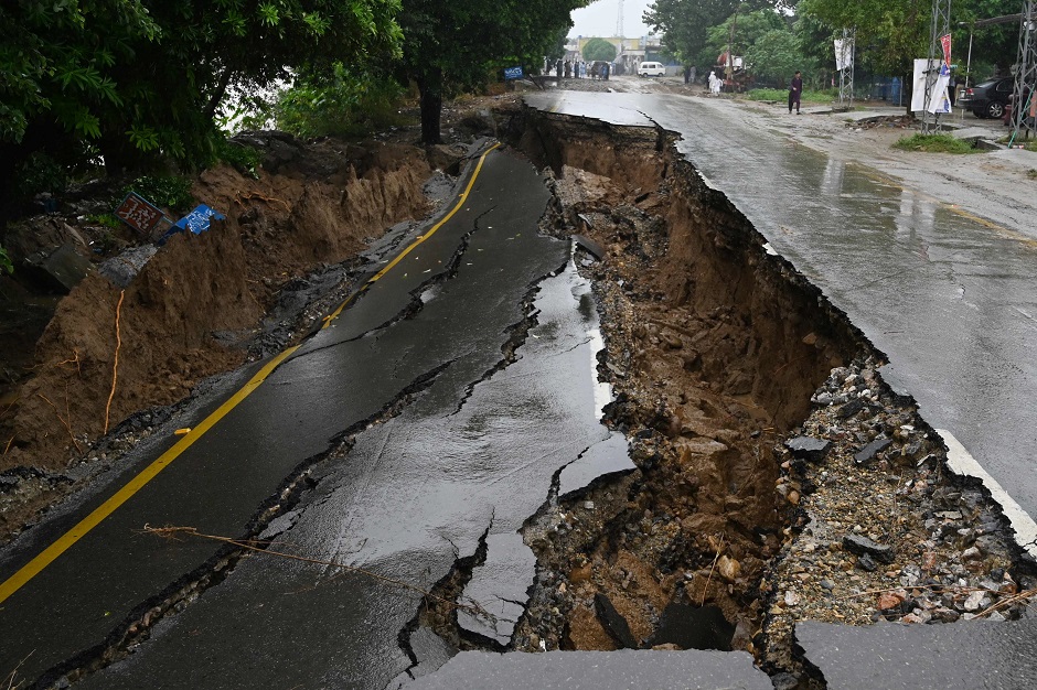 A damaged road is pictured in an earthquake-hit area on the outskirts of Mirpur. PHOTO: AFP