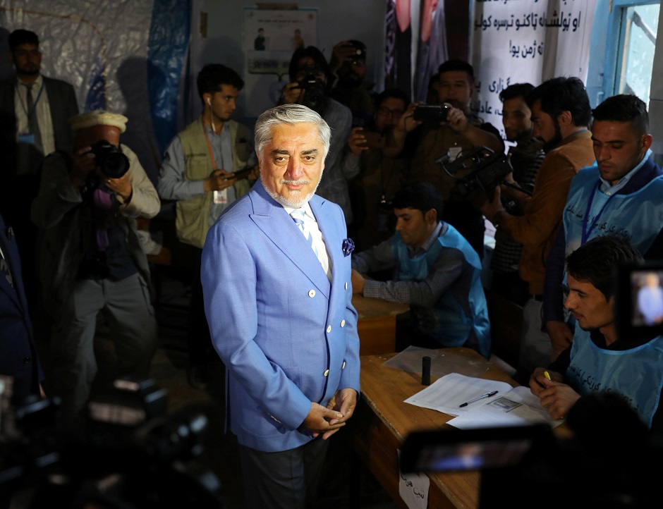 Afghan presidential candidate Abdullah Abdullah arrives to cast his vote at a polling station in Kabul. PHOTO: Reuters 