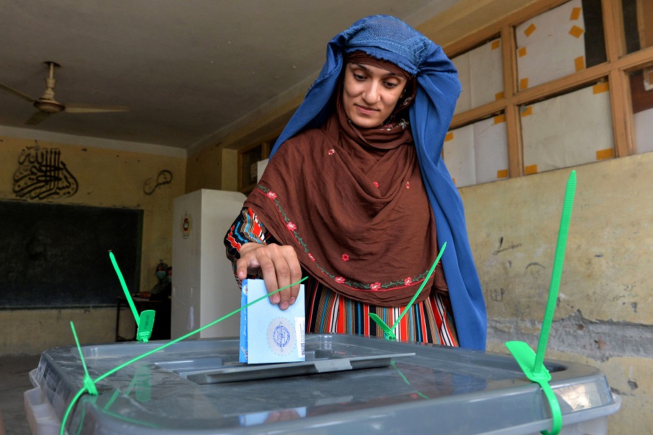 A woman casts her vote at a polling station in Jalalabad. PHOTO: AFP