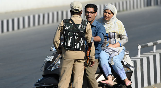 Kashmiri civilians are stopped at a checkpoint during heavy restrictions on movements in Srinagar on September 10, 2019, on the 10th day of the holy month of Muharram. PHOTO: AFP