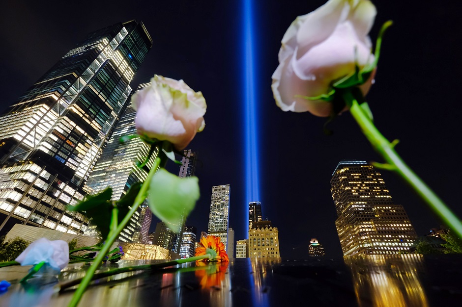 The 'Tribute in Light' seen from the bronze parapet surrounding the North Pool, rises skyward in New York City. PHOTO: AFP