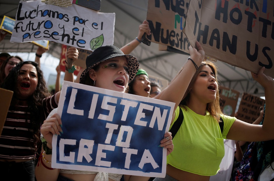  People hold placards during a Fridays for Future march calling for urgent measures to combat climate change, in Monterrey, Mexico. PHOTO: Reuters