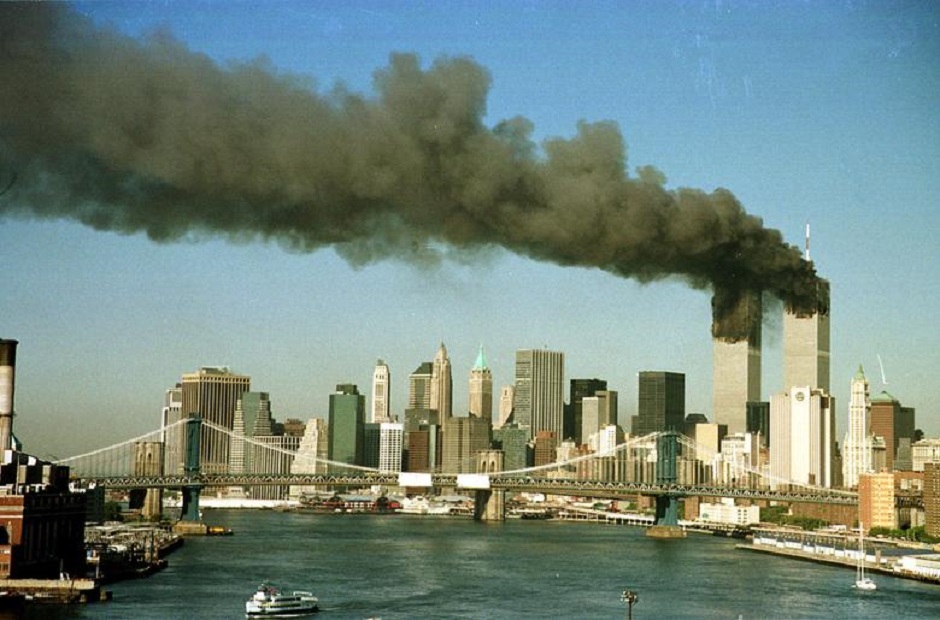The towers of the World Trade Center pour smoke shortly after being struck by hijacked commercial aircraft September 11, 2001. PHOTO: Reuters