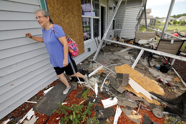 Cathy McCabe walks amidst the remnants of her damaged house after a tornado spawned by Hurricane Dorian ripped through Carolina Shores. PHOTO: Reuters