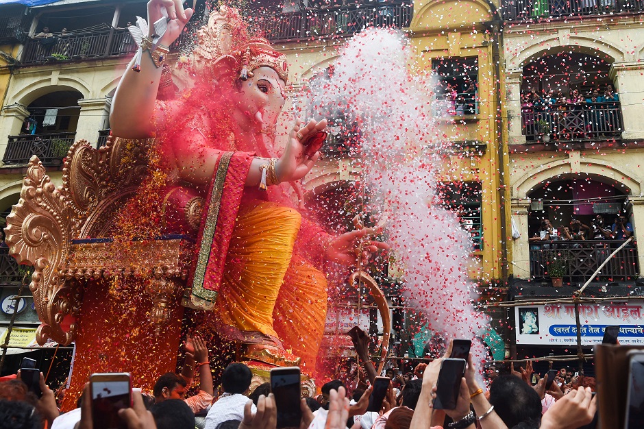 Devotees march with an idol of the elephant-headed Hindu deity Ganesha during the Ganesh Chaturthi festival in Mumbai. PHOTO: AFP