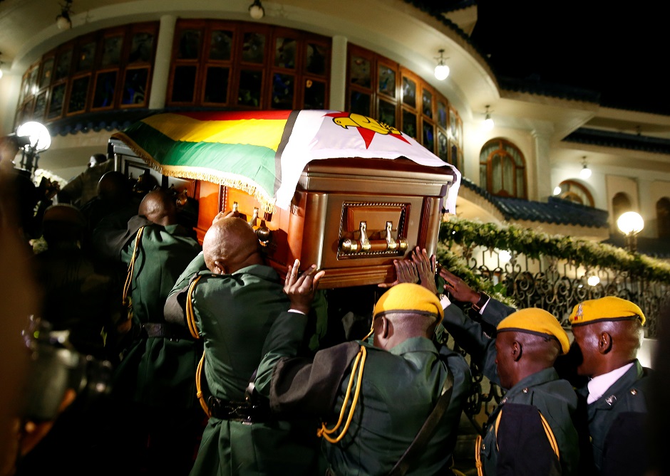 The body of former Zimbabwean President Robert Mugabe arrives at the 'Blue Roof', his residence in Borrowdale. PHOTO: Reuters