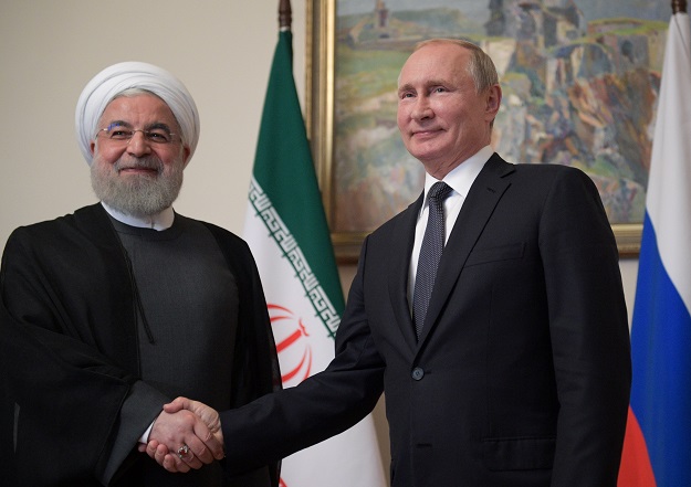 Russian President Vladimir Putin shakes hands with Iranian President Hassan Rouhani during a meeting on the sidelines of a session of the Supreme Eurasian Economic Council In Yerevan, Armenia. PHOTO: REUTERS