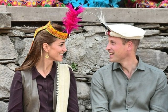  Britain's Prince William and Catherine, Duchess of Cambridge look at each other while visiting a settlement of the Kalash people in Chitral, Pakistan. PHOTO: REUTERS