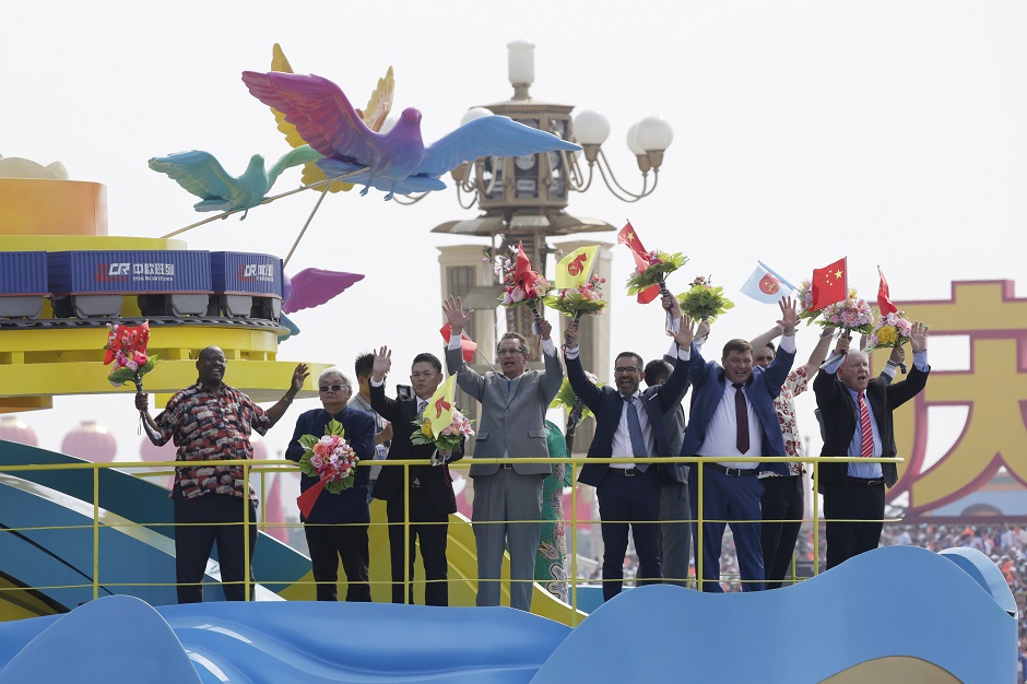  Foreigners are seen on a float featuring China Railway Express containers of the Belt and Road Initiative during the parade. PHOTO: Reuters