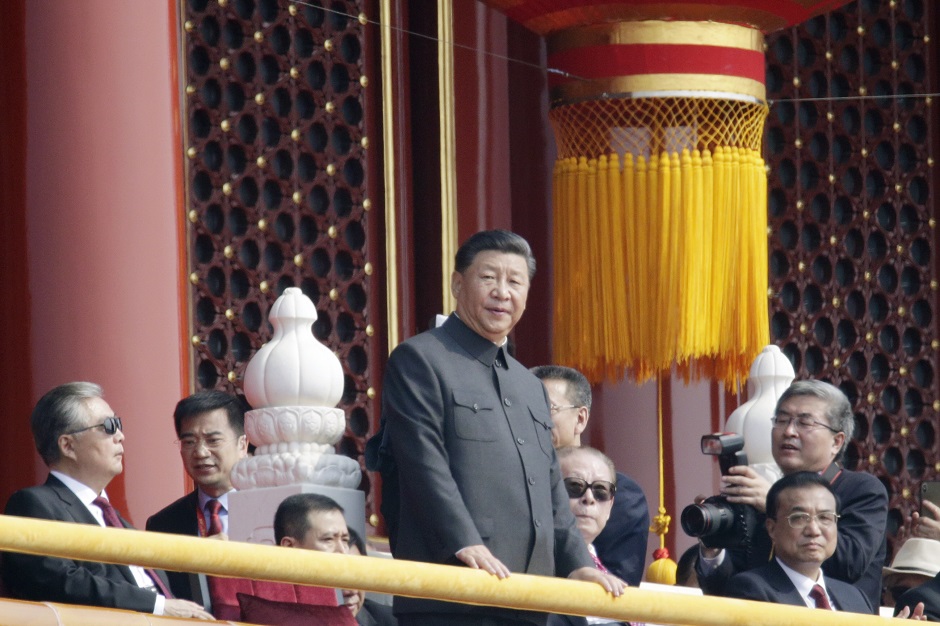  Chinese President Xi Jinping stands near former Chinese presidents Hu Jintao, Jiang Zemin and Premier Li Keqiang on Tiananmen Gate during the military parade marking the 70th founding anniversary of People's Republic of China. PHOTO: Reuters