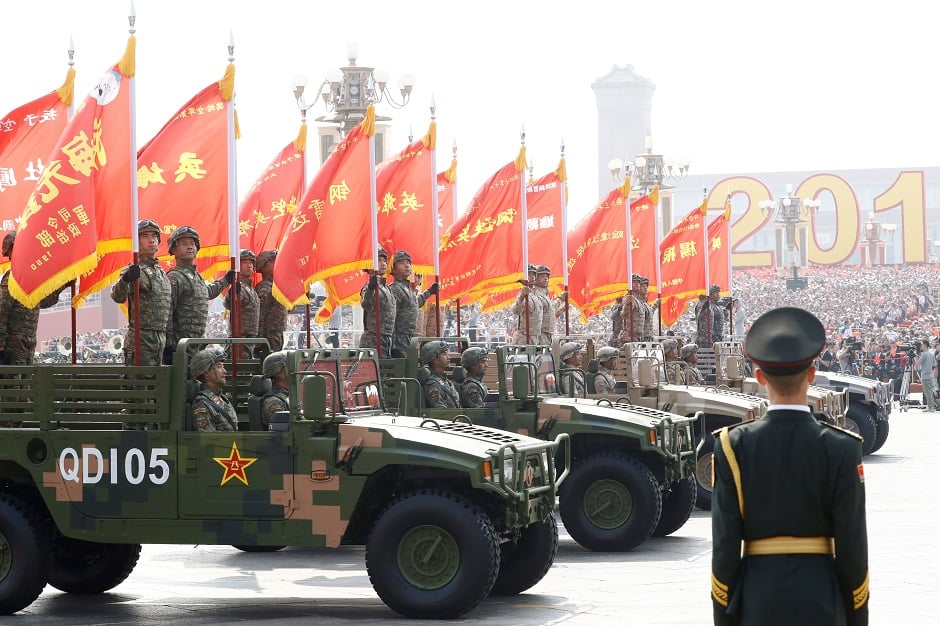  Troops in military vehicles take part in the military parade marking the 70th founding anniversary of People's Republic of China. PHOTO: Reuters 