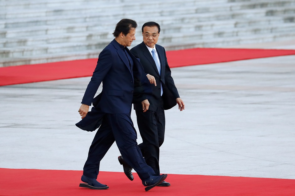 Pakistan's Prime Minister Imran Khan attends a welcome ceremony with Chinese Premier Li Keqiang outside the Great Hall of the People in Beijing, China. PHOTO: Reuters