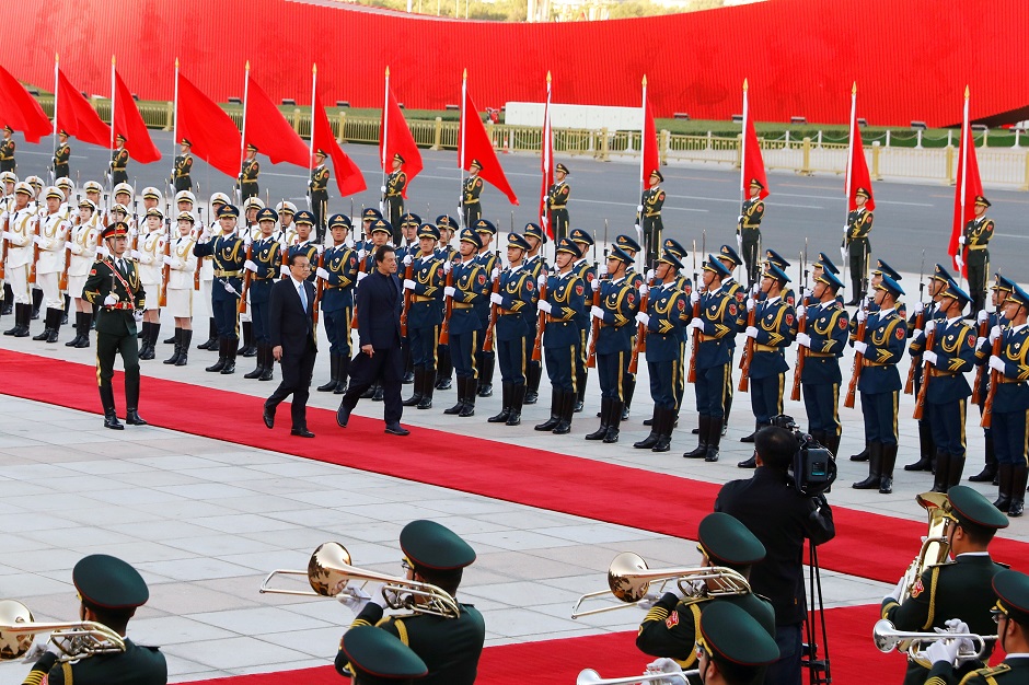 Pakistan's Prime Minister Imran Khan reviews the honour guard during a welcome ceremony with Chinese Premier Li Keqiang outside the Great Hall of the People in Beijing, China. PHOTO: Reuters