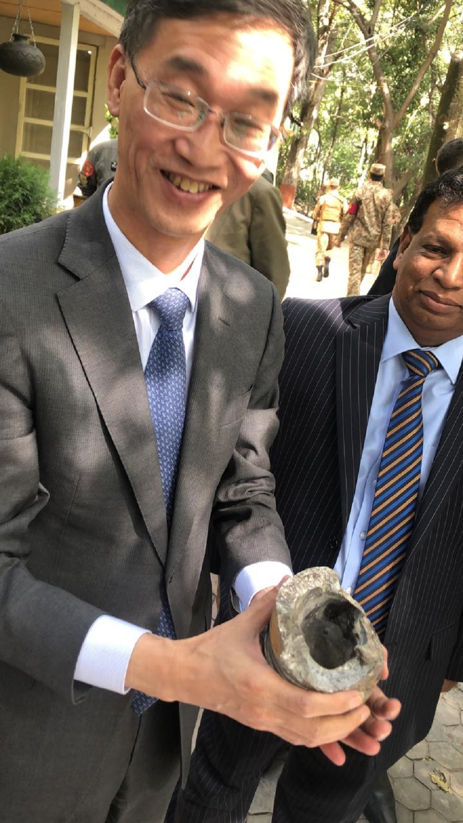 The diplomats and accompanying media personnel are shown remnants of the shells fired by Indian forces. PHOTO: EXPRESS 