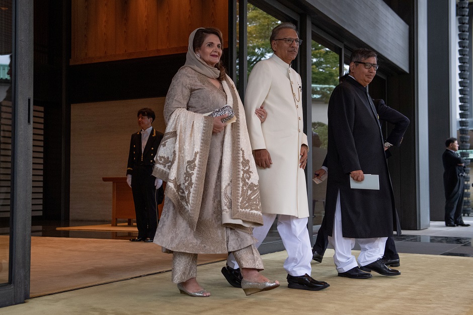 President Arif Alvi, and his wife Samina Alvi, leave after attending the Enthronement Ceremony of Emperor Naruhito of Japan. PHOTO: Reuters