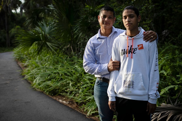 Anthony Borges and his father Royer Borges pose for a photo during an interview with AFP (Photo: AFP)