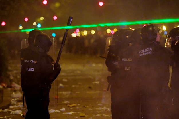 Laser pointers have been used to dazzle police in the Catalan protests -- a tactic copied from Hong Kong. PHOTO: AFP