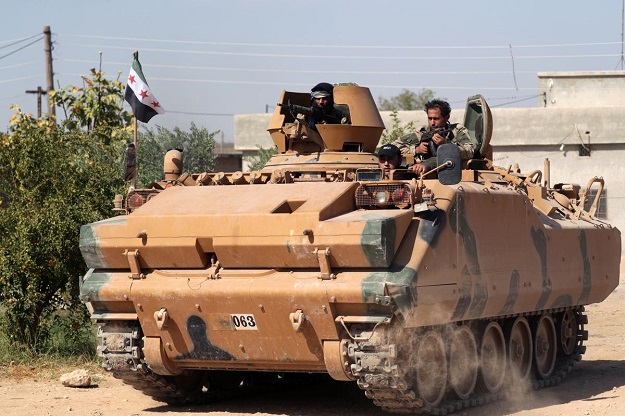 Forces advance into Syrian border town 
