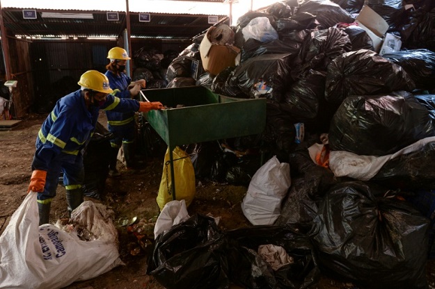 Mountaineers warn that this year's clean-up collected just a fraction of the rubbish on Mount Everest. PHOTO: AFP 