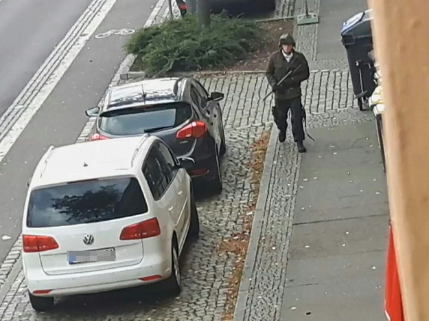 A video screenshot shows an armed man in the streets of Halle on Wednesday. PHOTO: AFP