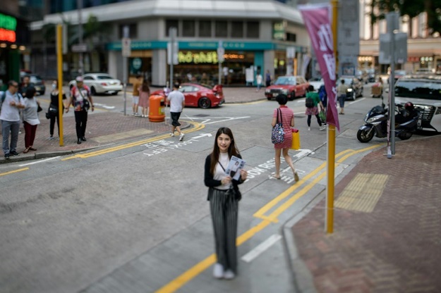 Local independent pro-democracy candidate Jocelyn Chau was attaked while running a streetside campaign booth (Photo: AFP)