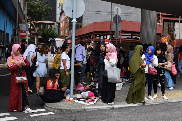 Indonesian migrant workers gathering near Victoria Park in Hong Kong (Photo: AFP)