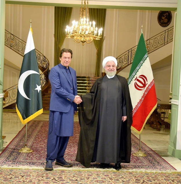 PM Imran Khan with Iranian President Hassan Rouhani in Tehran. PHOTO: PID