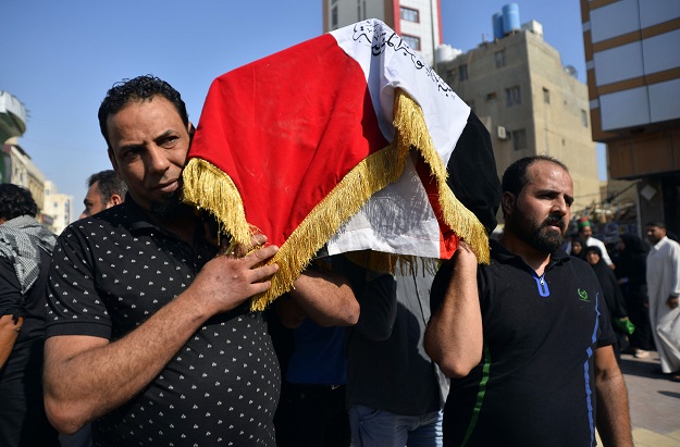 Iraqi mourners carry the coffin of a demonstrator reportedly killed the day before during anti-government protests in the capital Baghdad (Photo: AFP)