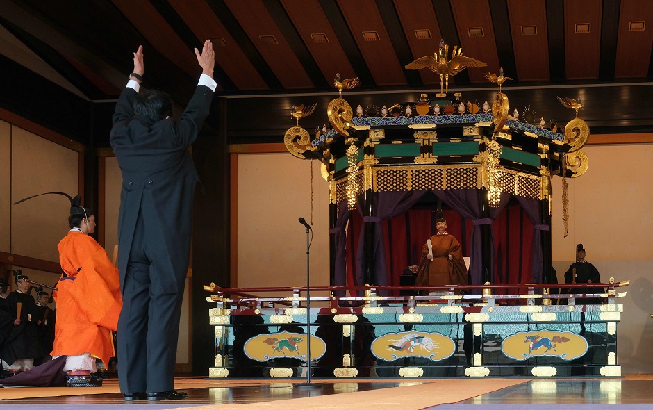 Prime Minister Shinzo Abe (L) shouts banzai cheer for Emperor Naruhito during the enthronement ceremony. PHOTO: AFP