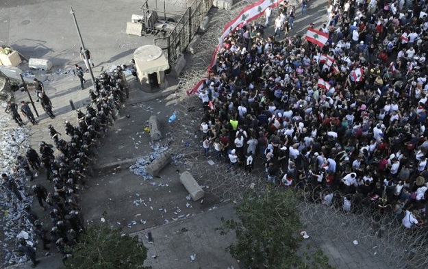 Lebanese security forces block a road as protesters rally in downtown Beirut. PHOTO: AFP