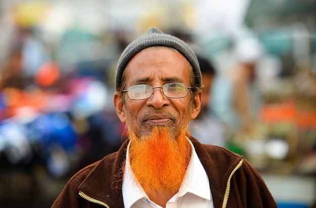 Henna enthusiast Eklas Ahmed with a henna-dyed beard poses for a photo in Dhaka (Photo: AFP)