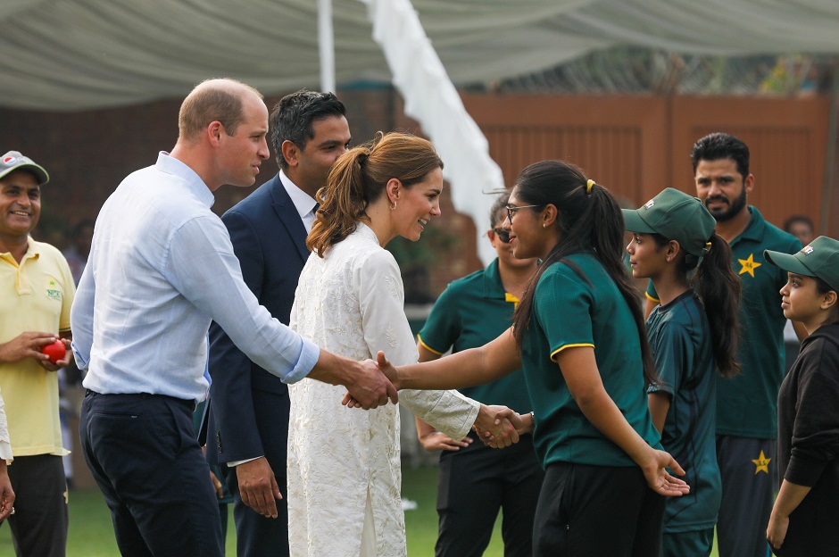 William and Kate shake hands with participants of the British Council's DOSTI (friendship) program at the National Cricket Academy in Lahore. (Photo: Reuters)