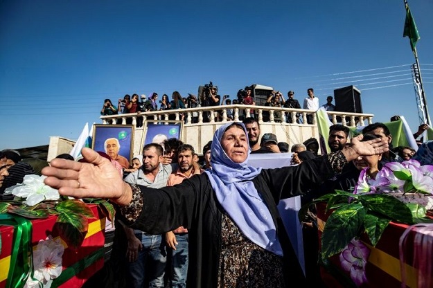 Mourners attend a funeral for Kurdish casualties. PHOTO: AFP