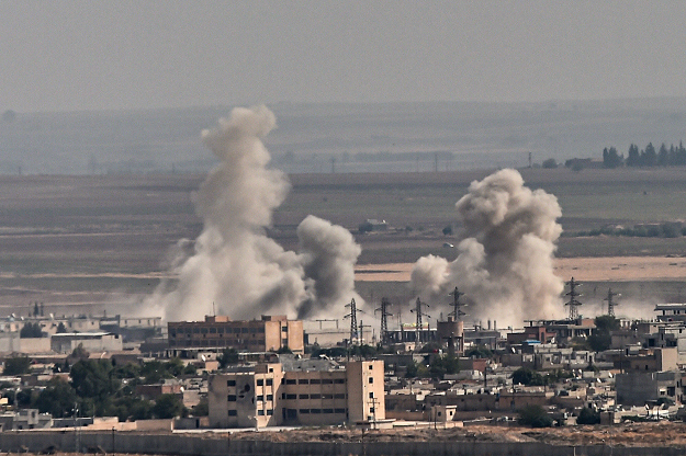 Smoke rises from the Syrian town of Ras al-Ain, in a picture taken from the Turkish side of the border in Ceylanpinar on October 11, 2019, on the third day of Turkey's military operation against Kurdish forces. PHOTO: AFP