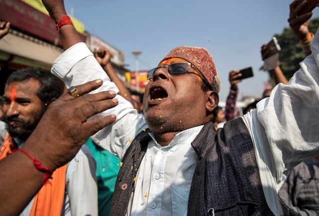 A Hindu devotee celebrates after Supreme Court's verdict on a disputed religious site, in Ayodhya, India, November 9, 2019. REUTERS/Danish Siddiqui