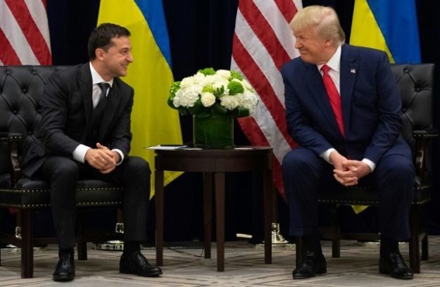 President Donald Trump (R) and Ukrainian President Volodymyr Zelensky speak during a meeting at the UN in New York on September 25, 2019; an earlier phone call formed the basis for an impeachment inquiry into the US leader. PHOTO: AFP