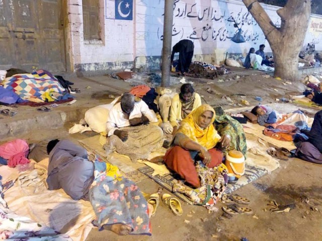 Patients and attendants coming to the SIUT for dialysis have been living roadside opposite the facility for years as they have nowhere else to go. PHOTOS: EXPRESS