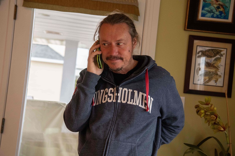 Svante Thunberg, father of Swedish climate activist Greta Thunberg, speaks on the phone on the eve of his return to Europe with his daughter aboard the catamaran La Vagabonde in Hampton. PHOTO: AFP