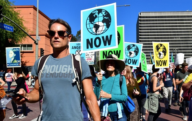 Activists march through downtown Los Angeles in November 2019 in a climate change rally addressed by teenage Swedish activist Greta Thunberg. PHOTO: AFP