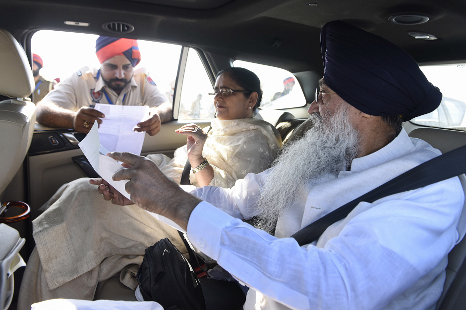 Sikh pilgrims show their documnets to Indian police before crossing over to Pakistan for the inauguration ceremony of the Kartarpur Corridor in Dera Baba Nanak on November 9, 2019, as Indian Sikh pilgrims visited the shrine of Baba Guru Nanak Dev at the Gurdwara Darbar Sahib.. PHOTO: AFP