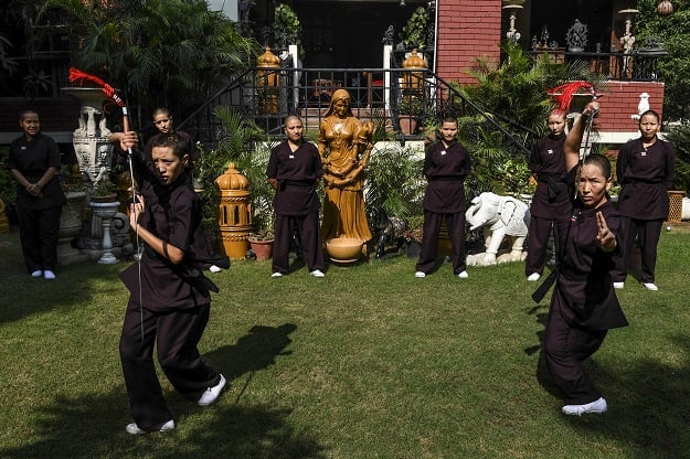 Members of the Kung Fu Nuns group demonstrate their skills in New Delhi. PHOTO: AFP
